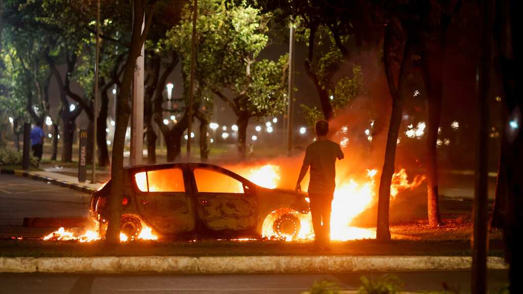 Bolsonaro supporters try to invade police HQ on day Lula is certified as president
