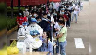 Covid cases surge in China as hardline policy eases