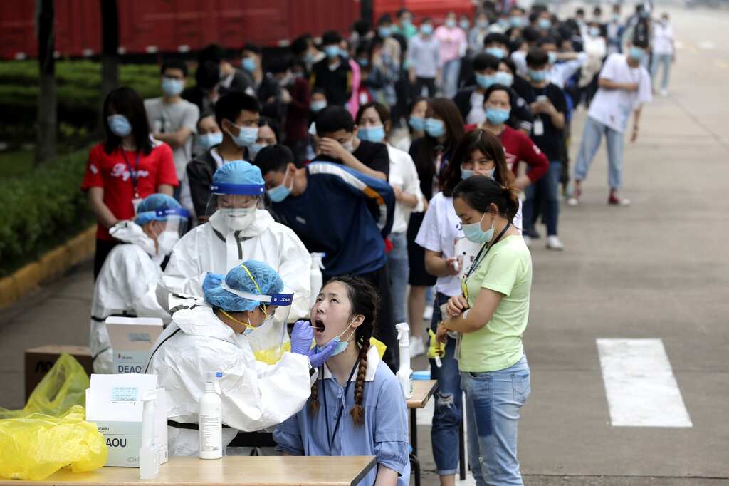 Covid cases surge in China as hardline policy eases