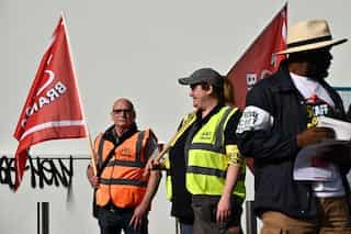 UK minister accuses unions of 'inflicting harm' on patients as thousands of health and public workers walk out