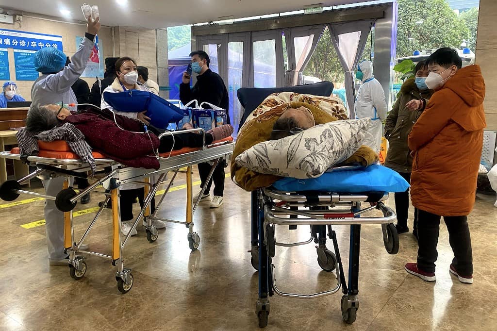 As virus cases surge, China limits definition of Covid deaths in official toll