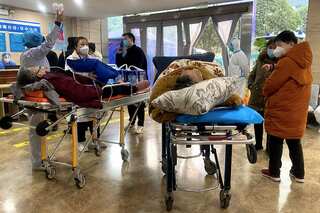 As virus cases surge, China limits definition of Covid deaths in official toll