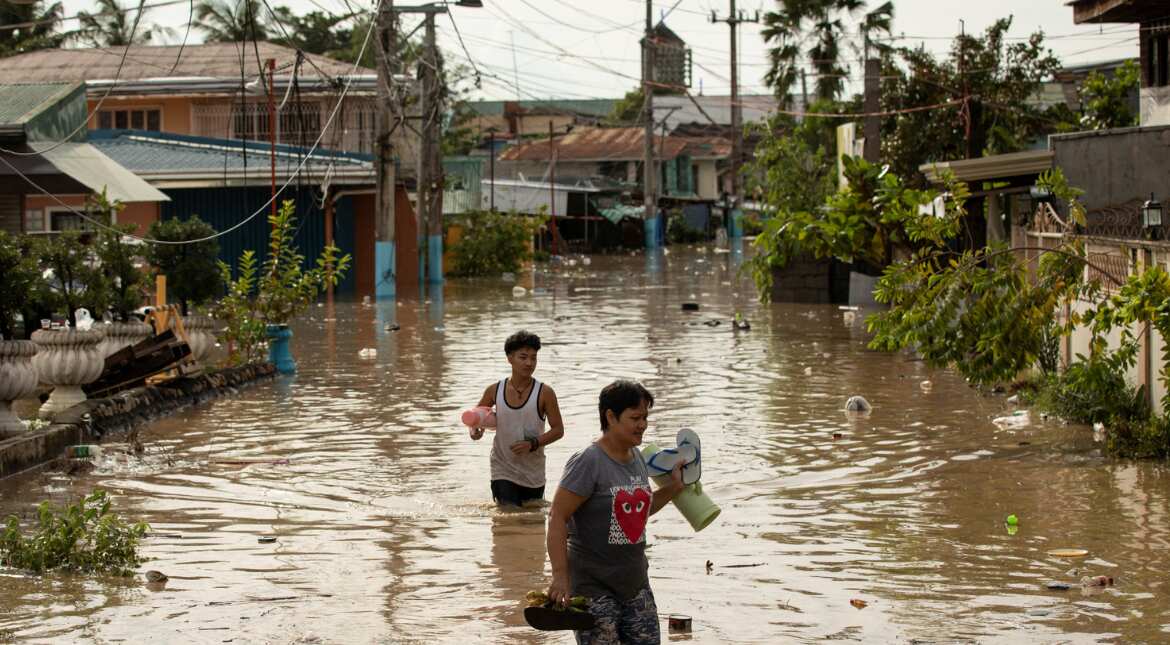 Philippines floods force evacuation of tens of thousands on Christmas day