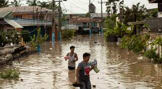 Philippines floods force evacuation of tens of thousands on Christmas day