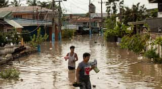 Philippines floods force evacuation of tens of thousands on Christmas day