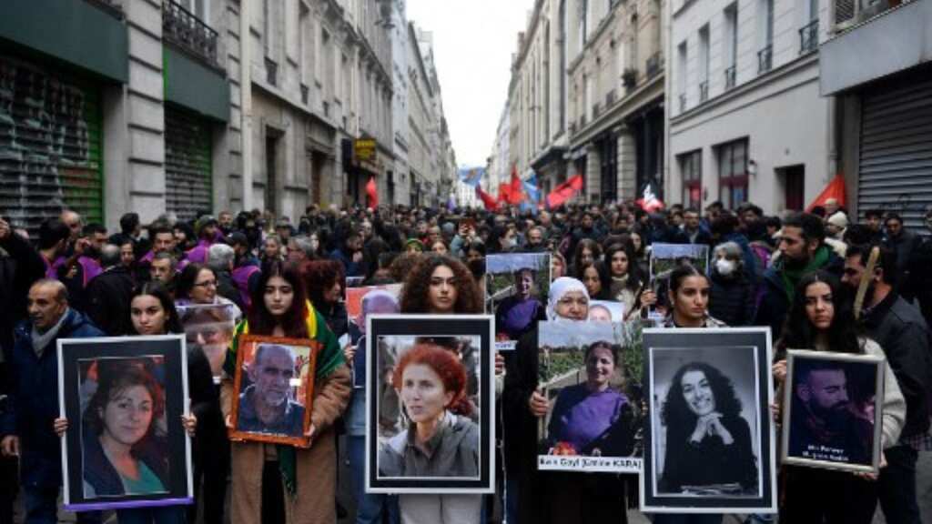 Paris shooting suspect charged as tribute rallies take place in France