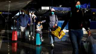 China calls on travellers to reduce trips in bid to minimise Covid risk