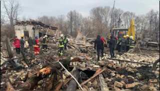 Rescuers clear up debris after Russian missiles target Kyiv
