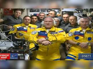 Russian cosmonauts put up New Year decorations in zero gravity