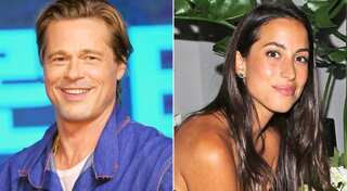 Brad Pitt and Ines de Ramon hold hands during British Grand Prix