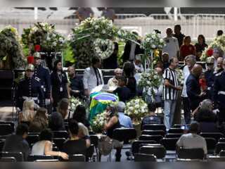 Brazil bids goodbye to football legend Pele with a 24-hour wake in Santos, Sao Paulo