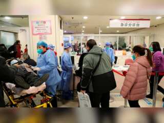 Chinese hospitals, funeral homes 'extremely busy' as Covid spreads