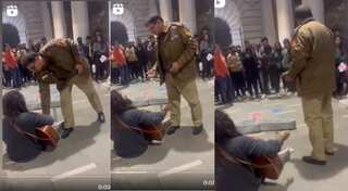WATCH| No sing a song for Delhi cops! Police shoo away a musician in Connaught Place
