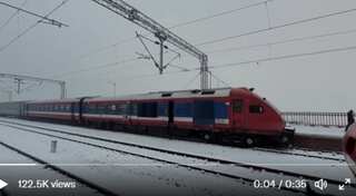 WATCH| Mesmerising view of train passing through snow-covered Jammu and Kashmir