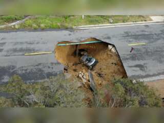 US: A giant sinkhole swallows two vehicles