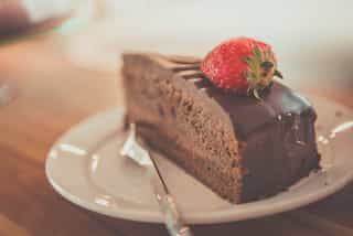 Eating cake in office as dangerous as smoking? UK food regulator calls for ban on cakes in offices