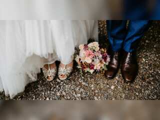 Bride wears Kente dress for her white wedding ceremony