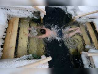 Watch: Residents of Ukraine's Kharkiv plunge into icy waters to mark Epiphany