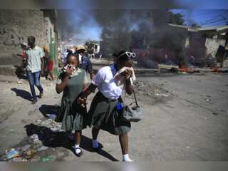 Protests in Haiti by police, tensions soar; roads blocked and airport stormed by protesters