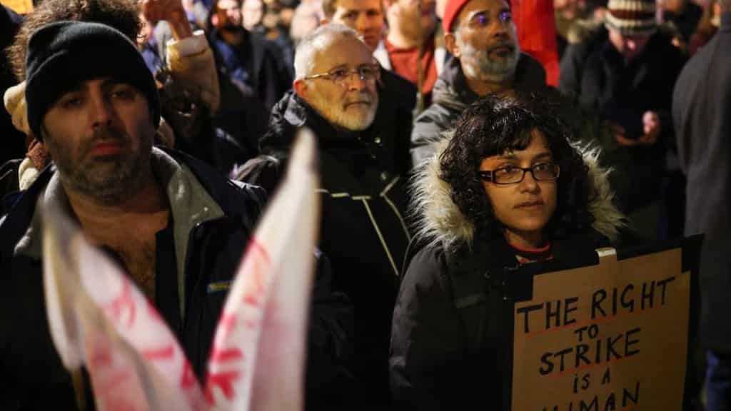 Britain's teachers, civil servants join country's biggest strike in a generation