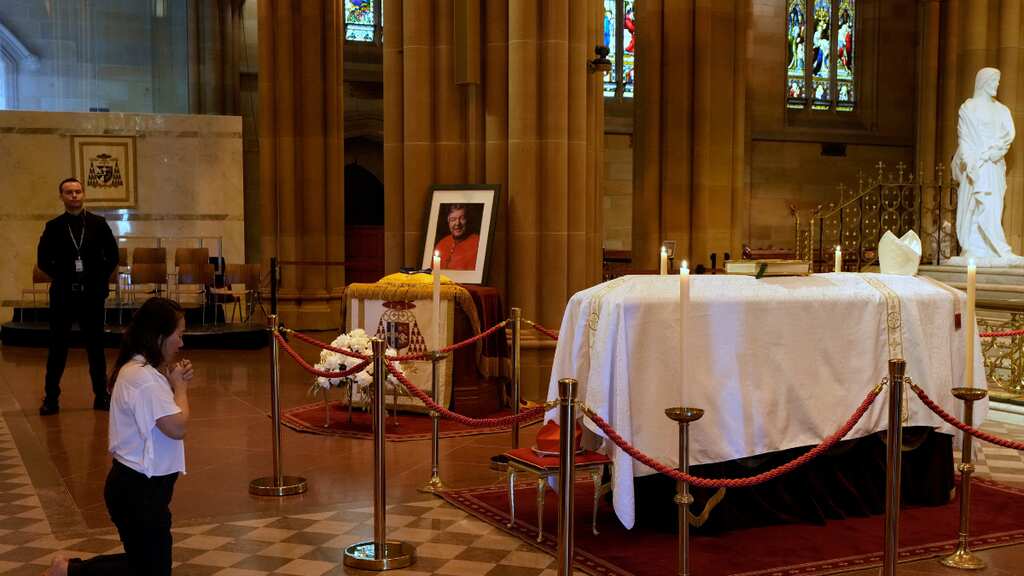 Australian Cardinal George Pell's funeral sparks protests as mourners gather
