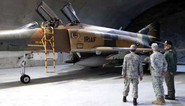 Iran reveals underground air force base, threatens Israel with 'response'