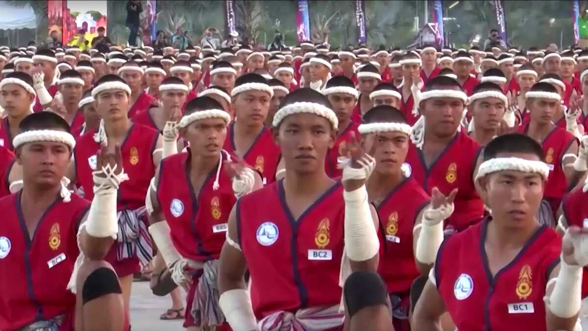Red uniform with white Mongkhon headbands