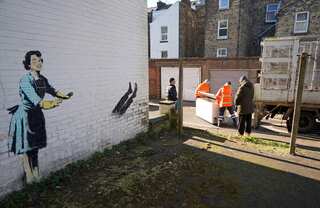 Chest freezer in British artist Banksy's installation returns, a day after its removal