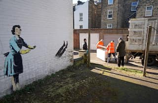 Chest freezer in British artist Banksy's installation returns, a day after its removal