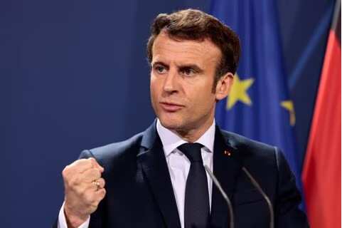 French President Emmanuel Macron signs controversial pension reforms into law
