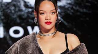 Rihanna's epic reaction to her historic Spotify milestone with 'no new album' is unmissable