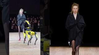 Robot dog reveals model's outfit at Coperni show during Paris Fashion Week F/W 2023