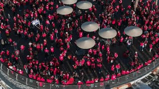 Women dressed in red form human chains to protest judicial overhaul in Israel