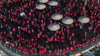 Women dressed in red form human chains to protest judicial overhaul in Israel