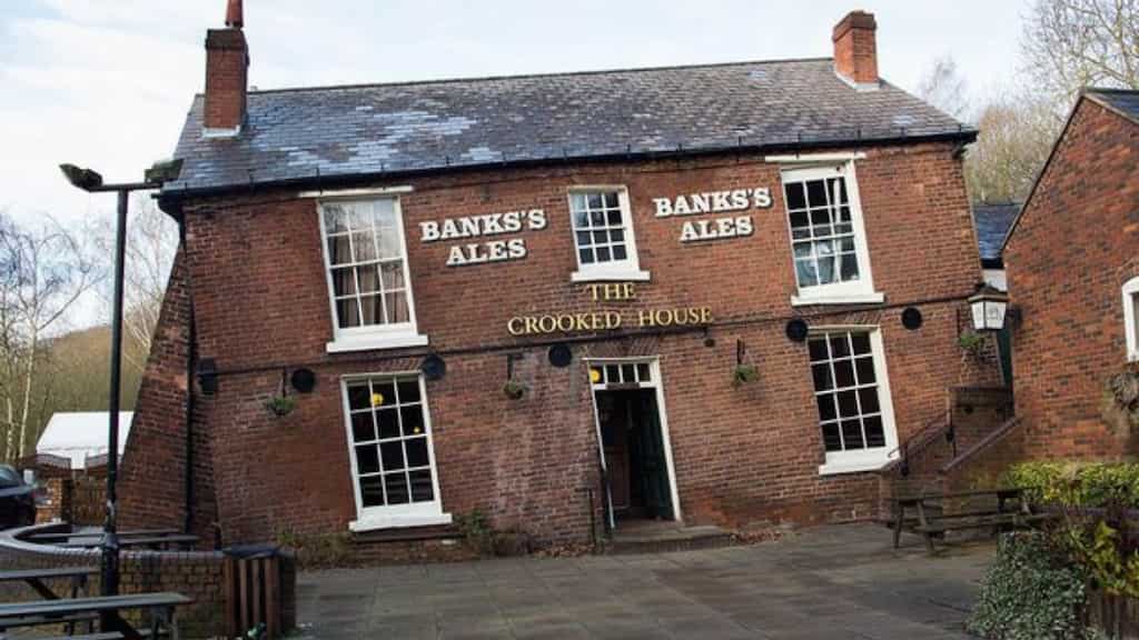 Britain's wonkiest pub 'The Crooked House', where coins roll uphill, up for sale