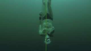 Man dives to record depth in frozen Swiss lake