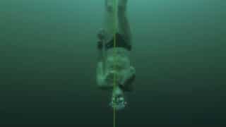 Man dives to record depth in frozen Swiss lake