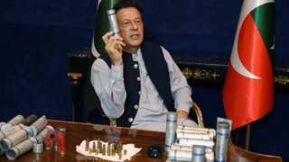 Imran Khan greets supporters as police halt efforts to arrest him following court orders