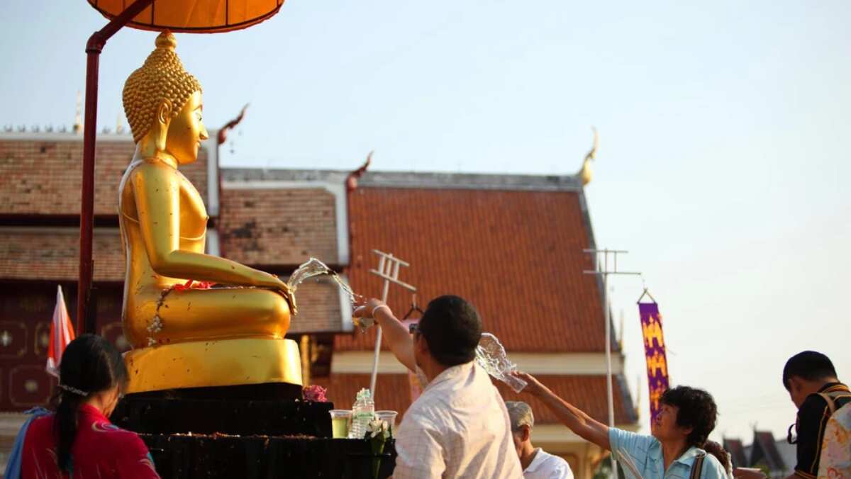 Bathing Buddha on Songkran water festival