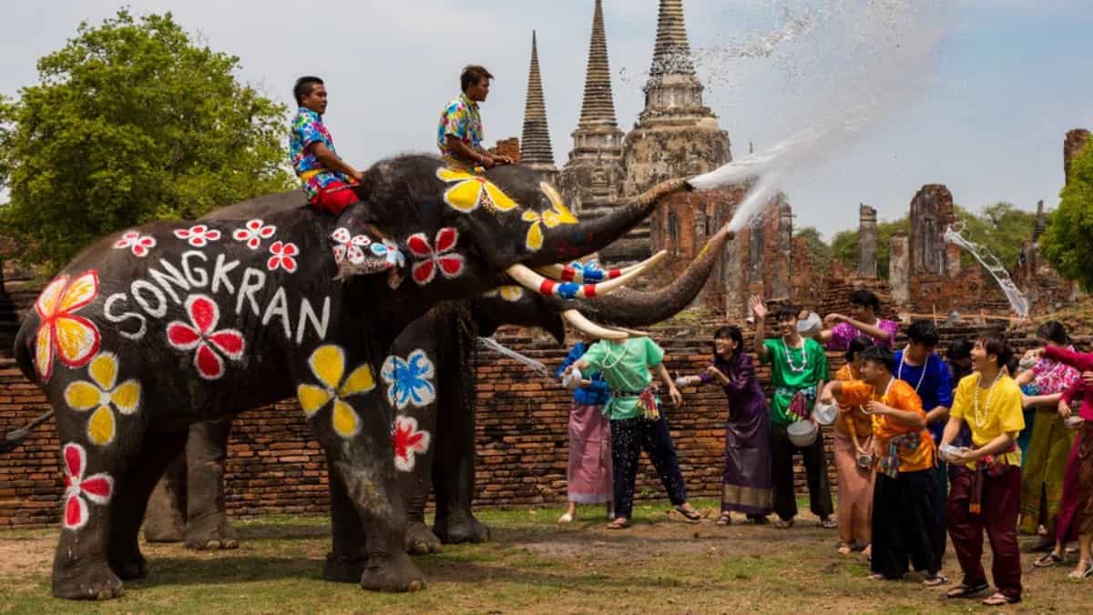 Celebrating Songkran water festival with elephants