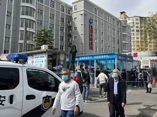 Watch: People sit on air conditioners, some jump off building as fire envelops Beijing hospital