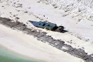 Australia rescues 11 Indonesian fishermen from desert island, 8 still missing