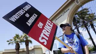 Late-night TV shows go dark as Hollywood writers strike for better pay