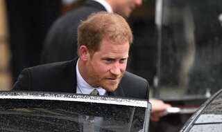 Prince Harry leaves Westminster Abbey alone as other royals join King's carriage procession