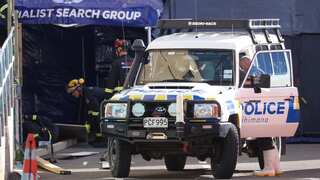 New Zealand police file five murder charges against man accused of setting hostel on fire 
