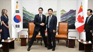 Trudeau’s ‘manner legs’ pose with Korean politician slammed as another gaffe by critics