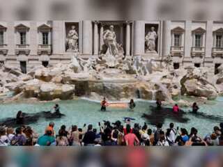Climate activists turn Rome's iconic Trevi fountain black