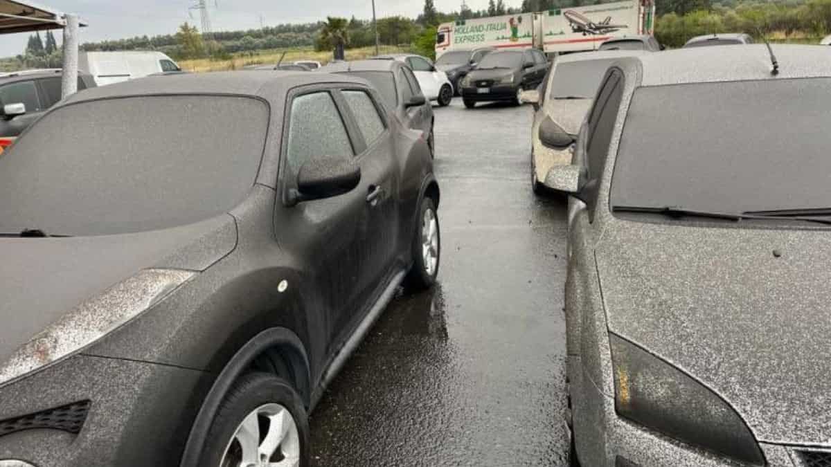 Layers of dark gritty dust covers cars