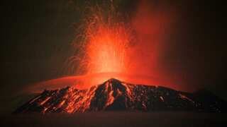 Mexico raises warning alarm for Popocatepetl volcano as it spews smoke, ash and molten rock