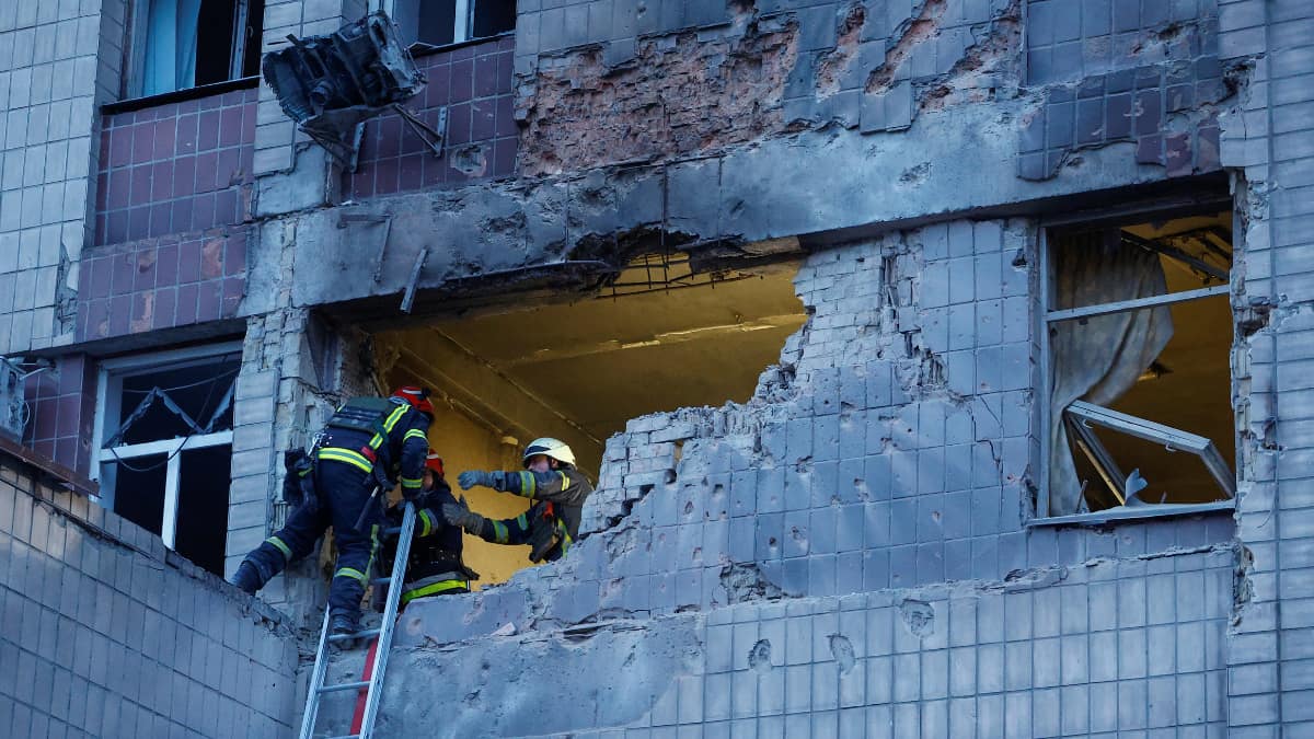 Rescuers work hard after the Russian drone attack